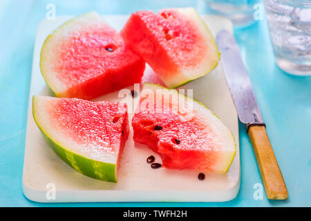 Watermelon chunks on wooden board Stock Photo