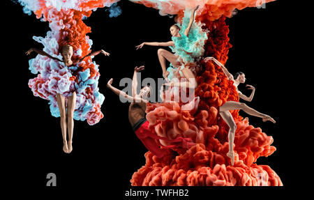 Abstract creative collage formed by color dissolving in water on black background. Bright combination of colors. Young dancers in clouds of smoke or dissolves. Graceful, flexibility and elegance. Stock Photo