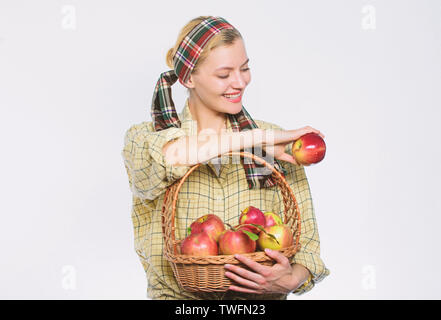 vitamin and dieting food. organic and vegetarian. healthy teeth. orchard, gardener girl with apple basket. Happy woman eating apple. spring harvest. summer fruit. Only the best fruits and vegetables. Stock Photo