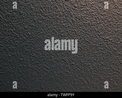 Black plastered textured wall. Abstract background texture concept Stock Photo