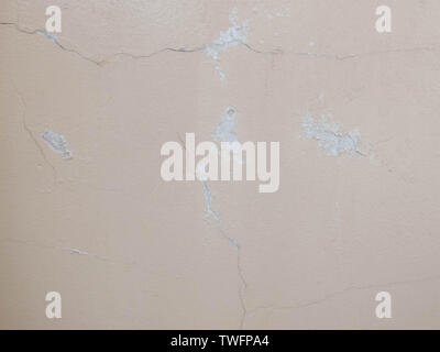Cracks on the plastered wall surface. Abstract background texture concept Stock Photo
