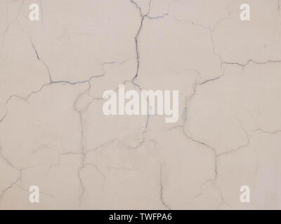 Cracks on the plastered wall surface. Abstract background texture concept Stock Photo