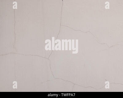 Cracks on the plastered wall surface. Abstract background texture concept Stock Photo