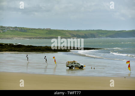 RNLI Lifeguard vehicle pictured on a deserted Coney Beach, Porthcawl, South Wales. Stock Photo