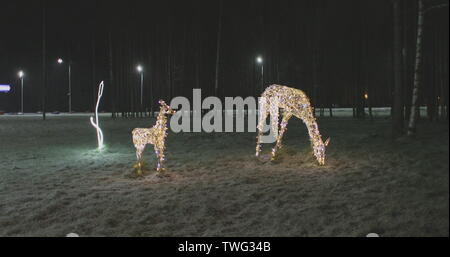 Christmas illumination of the deer family in the evening Stock Photo