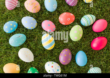 colored easter eggs on artificial grass Stock Photo