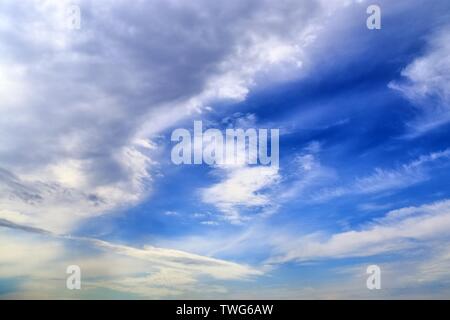 Beautiful mixed white and dark cloud formations on a blue sky Stock Photo