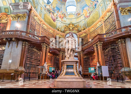 Interior of Austrian National Library - old baroque library of Hapsburg empire located in Hofburg Palace.