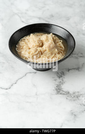 Cloud noodles on a marble table. Stock Photo