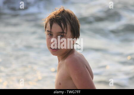 Young boy playing in the sea in Sri Lanka Stock Photo