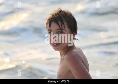 Young boy playing in the sea in Sri Lanka Stock Photo