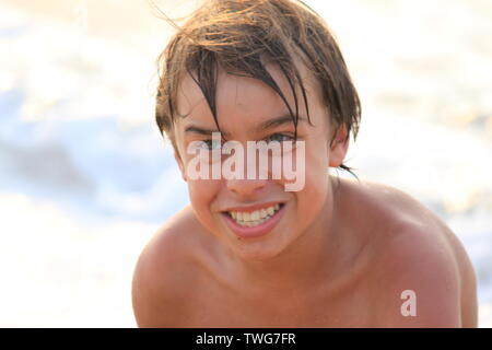 Young boy playing in the sea in Sri Lanka Stock Photo