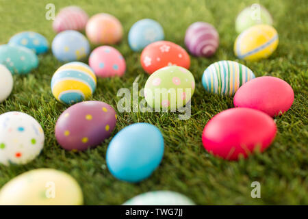 colored easter eggs on artificial grass Stock Photo