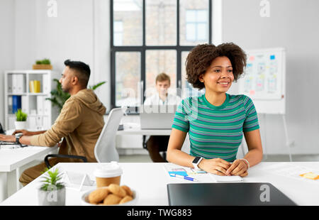happy smiling african american woman at office Stock Photo