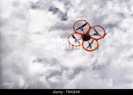 Drone on the clouded sky Stock Photo