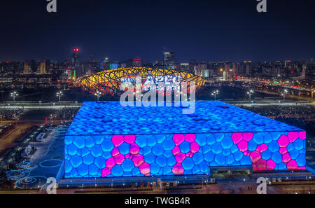 Beijing is recognized as the most changing city in the world. Fashion trendy, urban small capital and post-Olympic spirit have changed the urban landscape of Beijing for hundreds of years, whether it is the Bird's Nest, Water Cube, 798 and Sanlitun, all with color and full of temperature! The picture shows the water cube during the APEC period in Beijing, January 2, 2015. Stock Photo