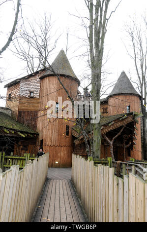 The Treehouse with a restaurant surrounded by its high roped walkways in the grounds of Alnwick castle at Alnwick in Northumberland, Britain. Stock Photo