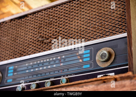 Old wooden radio receiver obsolete on wood shelf Stock Photo