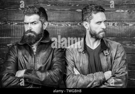 Men brutal bearded hipster. Confident competitors strict glance. Masculinity concept. Masculinity attributes. True man temper. Brutality confidence and masculinity interconnection. Exude masculinity. Stock Photo