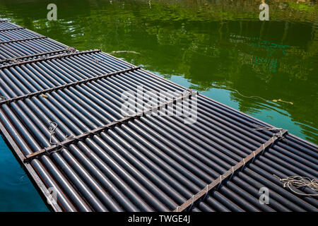 raft made from pipe in the river Stock Photo - Alamy