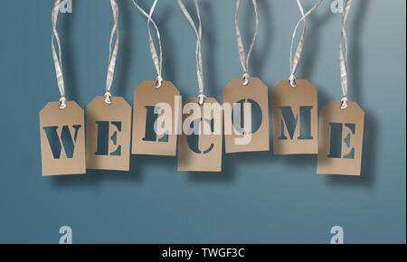 WELCOME on set of brown hang tags or cardboard labels against light blue background Stock Photo