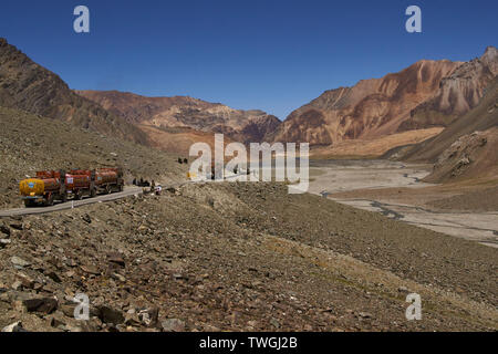 Colourful fuel tankers and trucks on the mountain road between Manali and Leh in Ladakh, India. Stock Photo