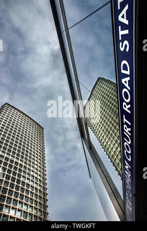 Centre point tower reflected in tottenham court road tube station signage. Stock Photo