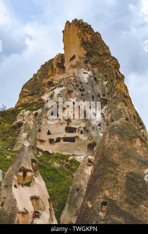 Abandoned dwellings in the rocks of volcanic tuff in Turkish Cappadocia. Goreme National Park. Stock Photo