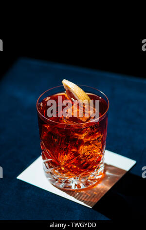 Negroni, an italian cocktail, an apéritif, first mixed in Firenze, Italy, in 1919. Count Camillo Negroni asked to strengthen his Americano by adding g Stock Photo