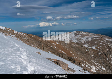 A snowy hike towards Mt Bierstadt, from the summit of Mount Evans. Stock Photo