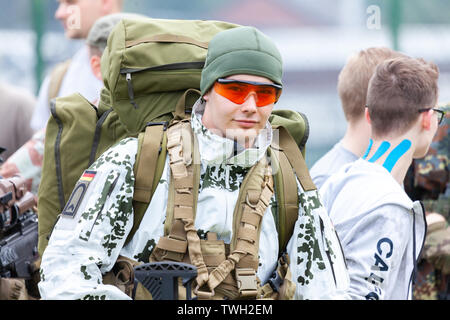 AUGUSTDORF / GERMANY - JUNE 15, 2019: German mountain trooper in snow camouflage suit walks at Day of the Bundeswehr 2019. Stock Photo