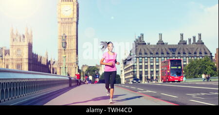 London lifestyle woman running near Big Ben. Female runner jogging training in city with red double decker bus. Fitness girl smiling happy on Westminster Bridge, London, England, United Kingdom. Stock Photo