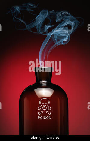 Steaming bottle of poison with skull and bones Stock Photo