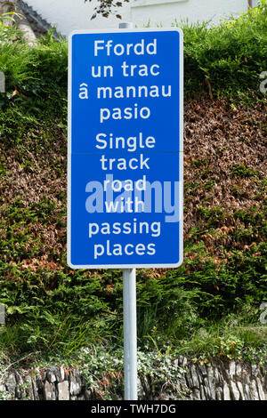 Road sign in Welsh and English language - single track road with passing places (Ffordd un trac a mannau pasio), Wales, UK Stock Photo