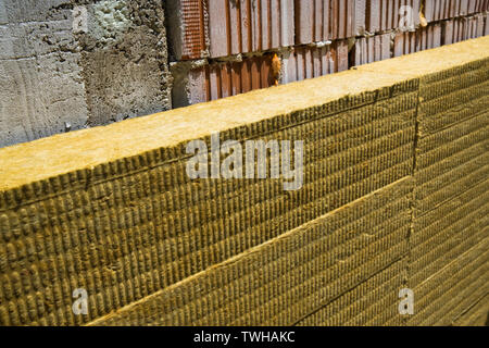 Rock wool insulation boards installed on the facade wall Stock Photo