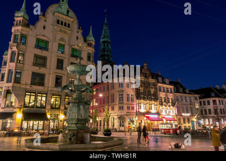 Copenhagen, Denmark: April 19, 2019: Famous Amagertorv square with classic buildings and a fountain, in a pedestrian area in the center of Copenhagen Stock Photo