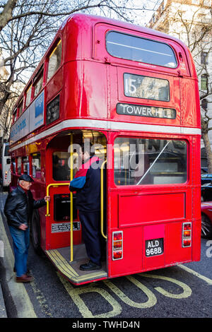 Passenger boarding a Number 15 London bus in London, UK on 17 December 2012 Stock Photo