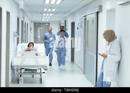 Medical team running in the corridor at hospital Stock Photo