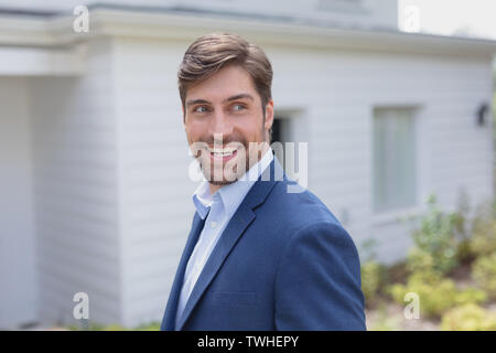 Businessman looking away in the garden Stock Photo