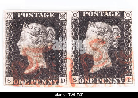 Horizontal pair of plate 1b Penny Black with red Maltese cross cancellation isolated on white background. Stock Photo