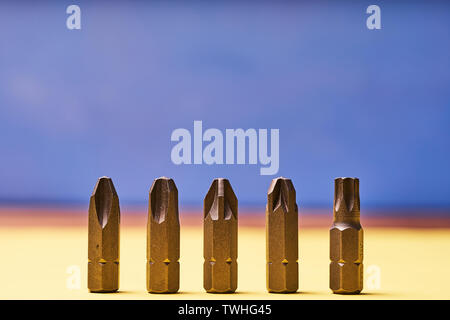 Bits for screwdrivers on a colored background. Stock Photo