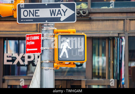 Walk traffic lights for pedestrians in New York city center, blur office buildings background, closeup view Stock Photo