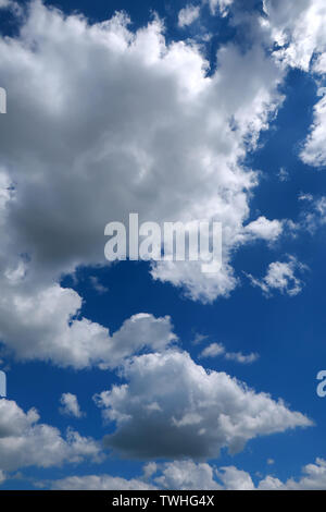 Deep blue sky and fluffy white clouds Stock Photo