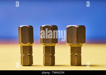 Bits for screwdrivers on a colored background. Stock Photo