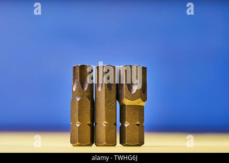 Bits for screwdrivers on a colored background. Stock Photo