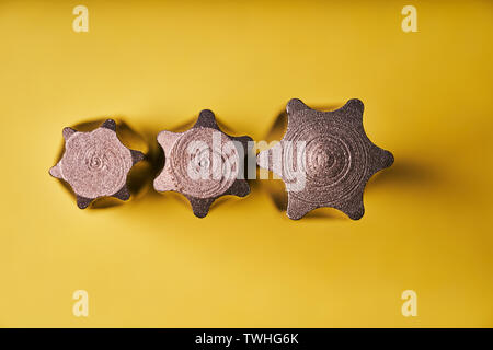 Three Torx bits for the screwdriver on a yellow background. Top view. Stock Photo