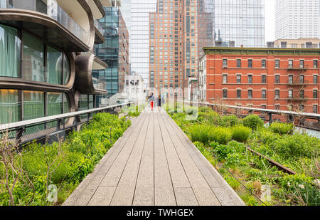USA, New York. May 4, 2019. Highline, Manhattan downtown. Tourists walking on the trail