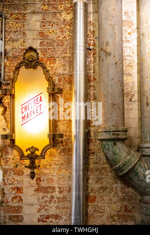 USA, New York. May 4, 2019. Chelsea market. Illuminated sign with text Chelsea market at the entrance. Stock Photo