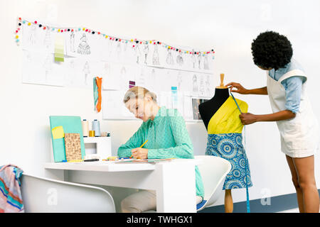 Female graphic designers working in office Stock Photo