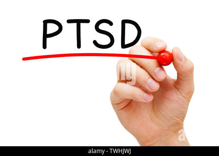 Hand writing PTSD Post Traumatic Stress Disorder with marker on transparent wipe board. Stock Photo